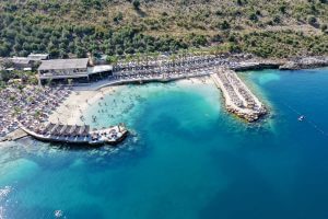Aerial view of private beach and turquoise sea at Mucobega Resort in Saranda